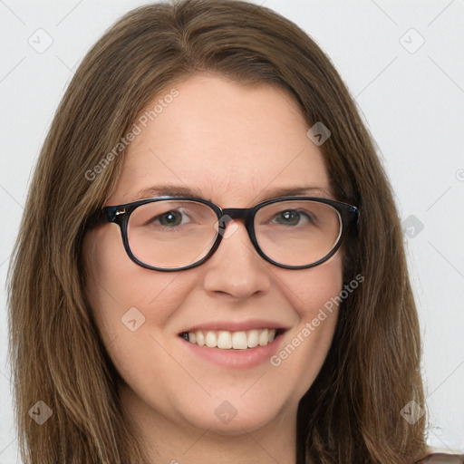 Joyful white young-adult female with long  brown hair and green eyes