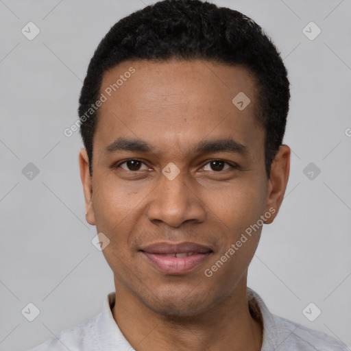 Joyful latino young-adult male with short  black hair and brown eyes