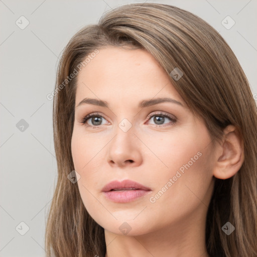 Neutral white young-adult female with long  brown hair and brown eyes