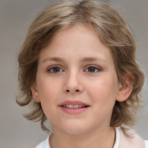 Joyful white child female with medium  brown hair and brown eyes