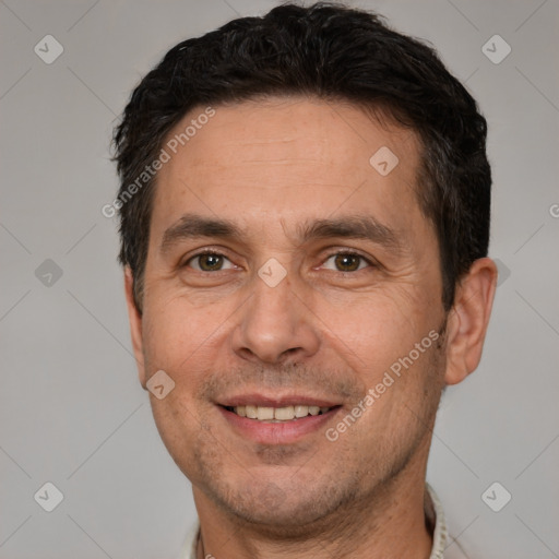 Joyful white adult male with short  brown hair and brown eyes