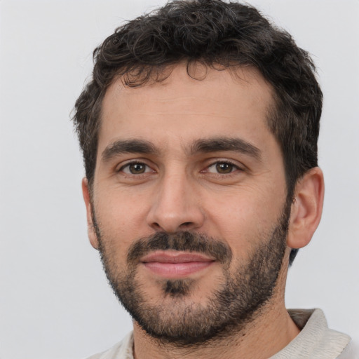 Neutral white young-adult male with short  black hair and brown eyes