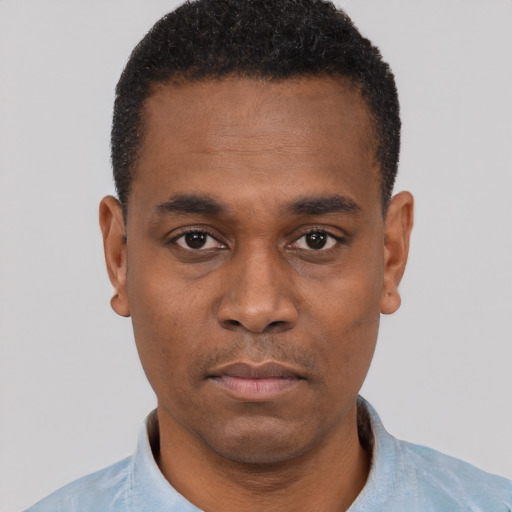 Neutral black young-adult male with short  black hair and brown eyes