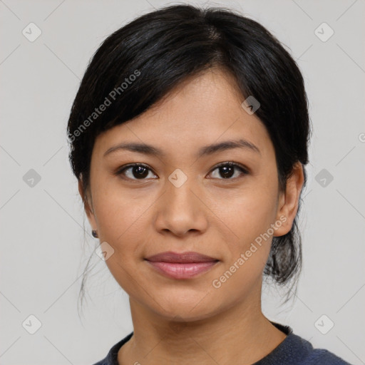 Joyful asian young-adult female with medium  black hair and brown eyes