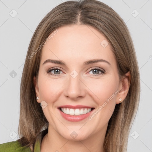 Joyful white young-adult female with medium  brown hair and grey eyes