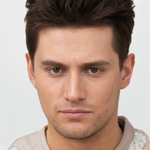 Neutral white young-adult male with short  brown hair and brown eyes