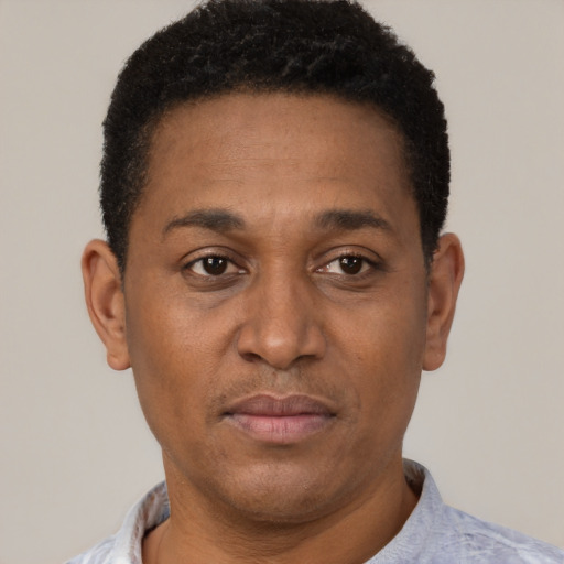 Neutral latino adult male with short  black hair and brown eyes