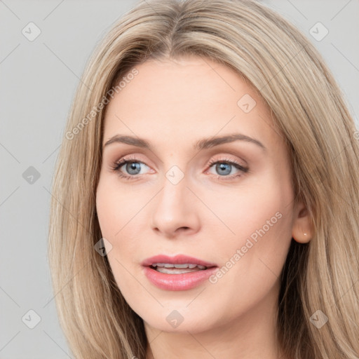 Joyful white young-adult female with long  brown hair and blue eyes