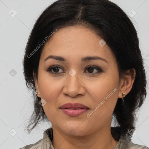 Joyful latino adult female with medium  brown hair and brown eyes