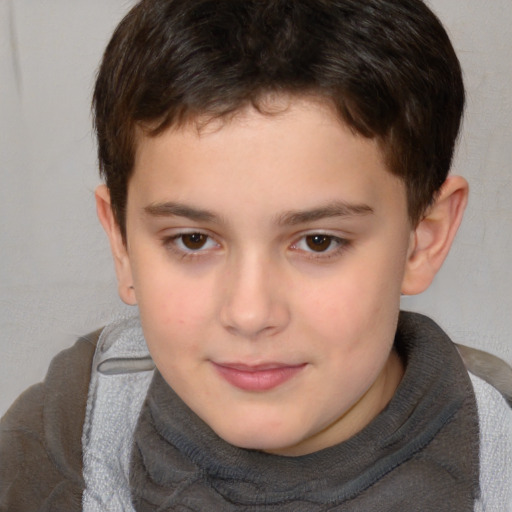 Joyful white child male with short  brown hair and brown eyes