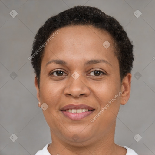 Joyful latino adult female with short  brown hair and brown eyes