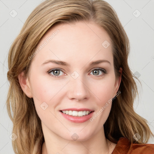 Joyful white young-adult female with medium  brown hair and blue eyes