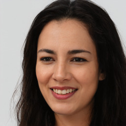 Joyful asian young-adult female with long  brown hair and brown eyes