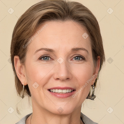 Joyful white adult female with medium  brown hair and grey eyes