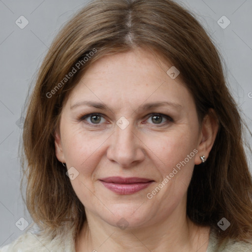 Joyful white adult female with medium  brown hair and grey eyes