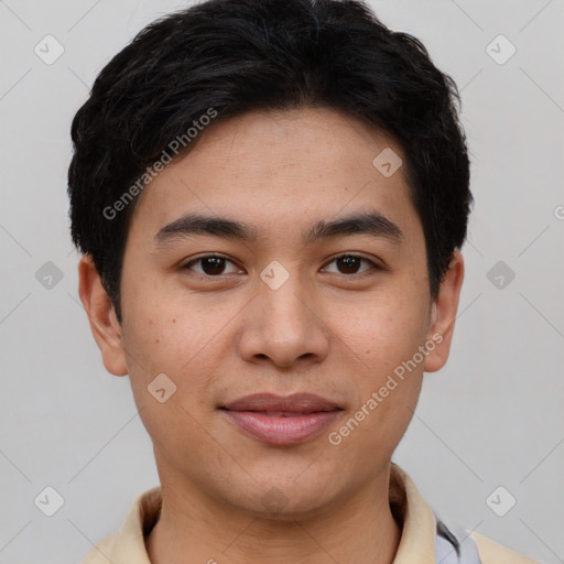 Joyful asian young-adult male with short  brown hair and brown eyes