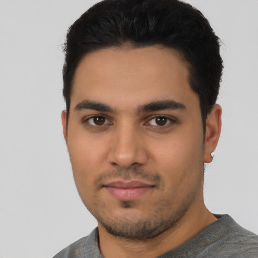 Neutral latino young-adult male with short  black hair and brown eyes