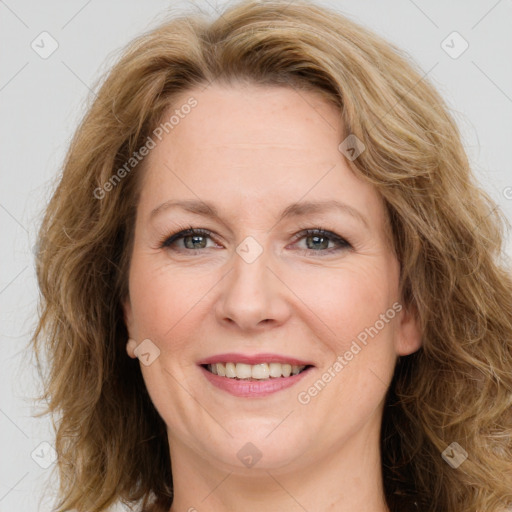 Joyful white adult female with long  brown hair and brown eyes