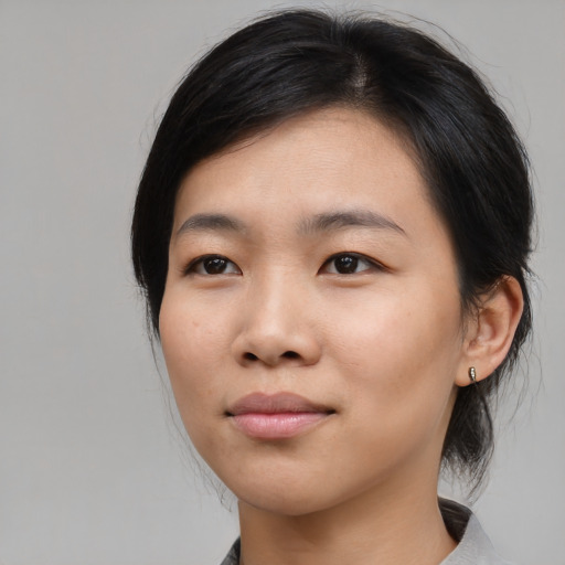 Neutral asian young-adult female with medium  black hair and brown eyes