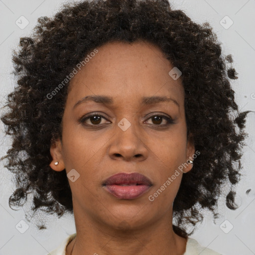 Neutral black adult female with medium  brown hair and brown eyes