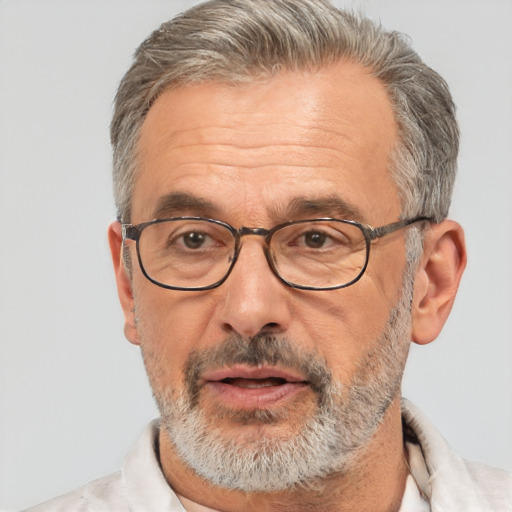 Neutral white middle-aged male with short  gray hair and brown eyes