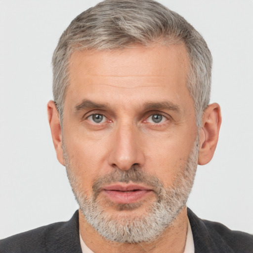 Neutral white middle-aged male with short  gray hair and brown eyes