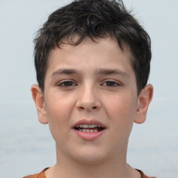 Joyful white child male with short  brown hair and brown eyes