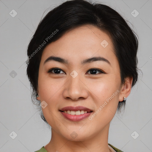 Joyful asian young-adult female with medium  black hair and brown eyes