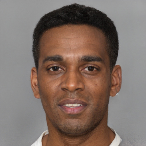 Neutral black young-adult male with short  black hair and brown eyes