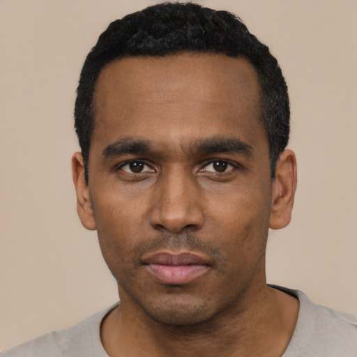 Neutral black young-adult male with short  black hair and brown eyes