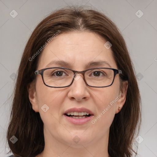 Joyful white adult female with medium  brown hair and brown eyes