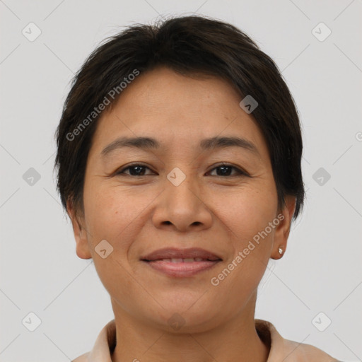 Joyful latino young-adult female with short  brown hair and brown eyes