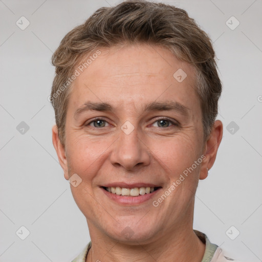 Joyful white adult female with short  brown hair and brown eyes