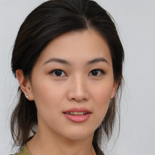 Joyful asian young-adult female with medium  brown hair and brown eyes