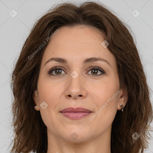 Joyful white adult female with long  brown hair and brown eyes