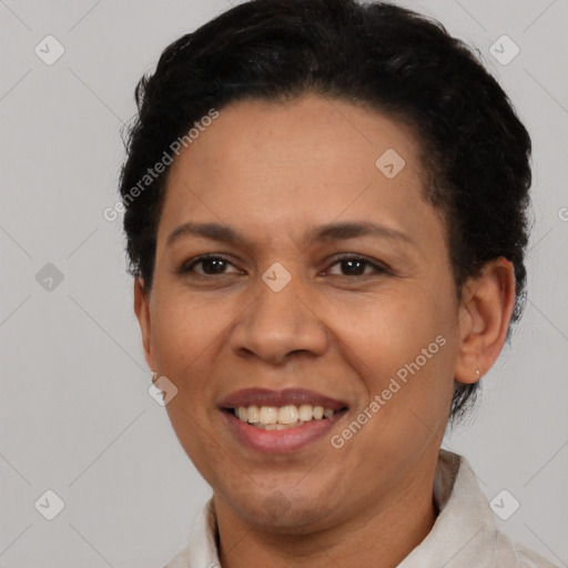 Joyful latino adult female with short  brown hair and brown eyes