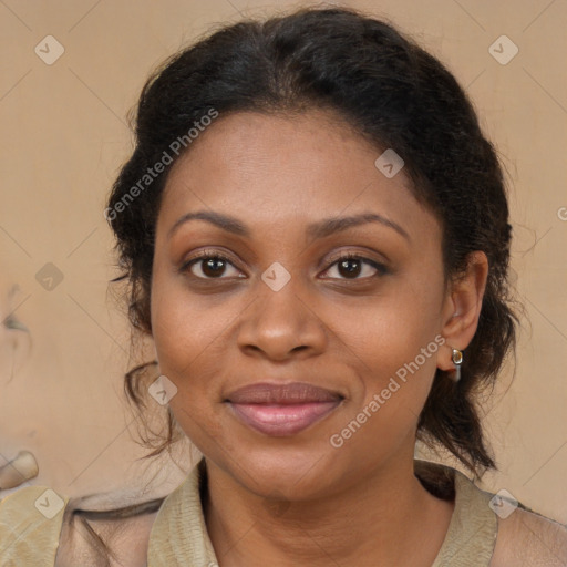 Joyful black adult female with medium  brown hair and brown eyes