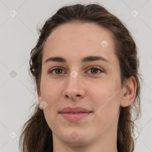 Joyful white young-adult female with medium  brown hair and grey eyes