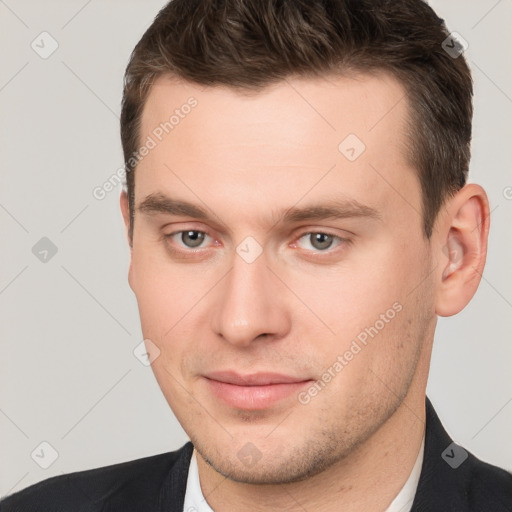 Neutral white young-adult male with short  brown hair and grey eyes