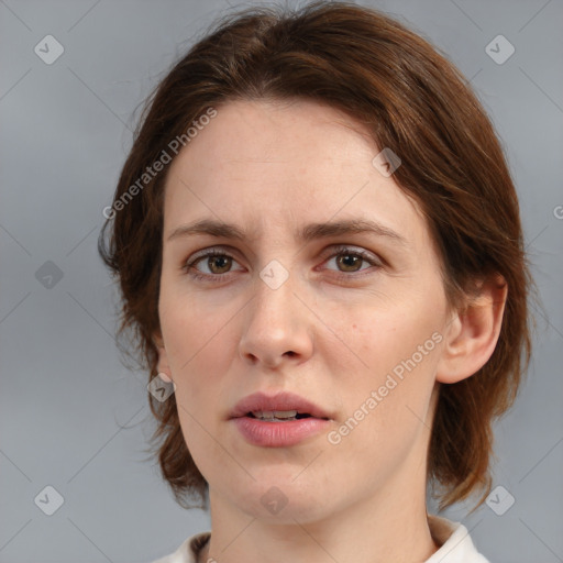 Neutral white young-adult female with medium  brown hair and grey eyes