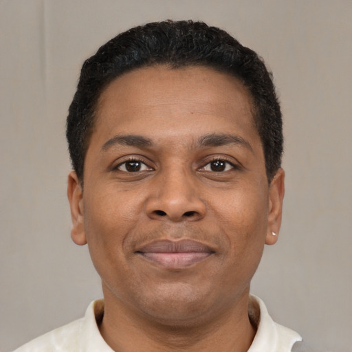 Neutral latino young-adult male with short  brown hair and brown eyes
