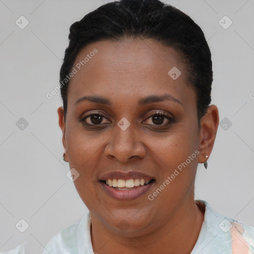 Joyful black young-adult female with short  black hair and brown eyes
