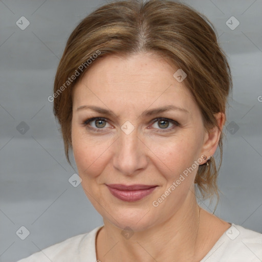 Joyful white adult female with medium  brown hair and grey eyes