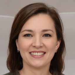 Joyful white young-adult female with medium  brown hair and brown eyes