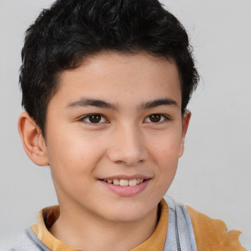 Joyful white child male with short  brown hair and brown eyes