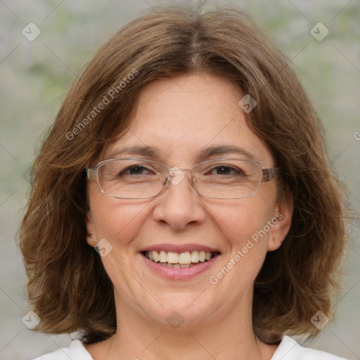 Joyful white adult female with medium  brown hair and green eyes