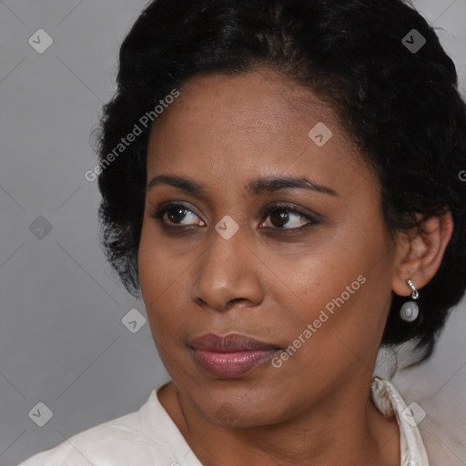 Joyful black young-adult female with medium  black hair and brown eyes