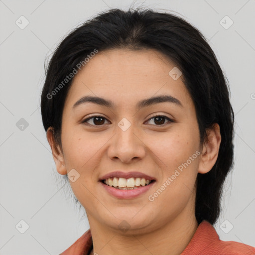 Joyful asian young-adult female with medium  brown hair and brown eyes