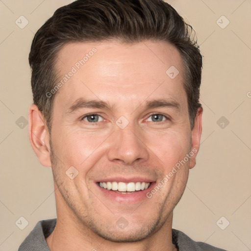 Joyful white adult male with short  brown hair and brown eyes