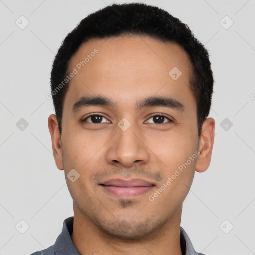 Joyful latino young-adult male with short  black hair and brown eyes